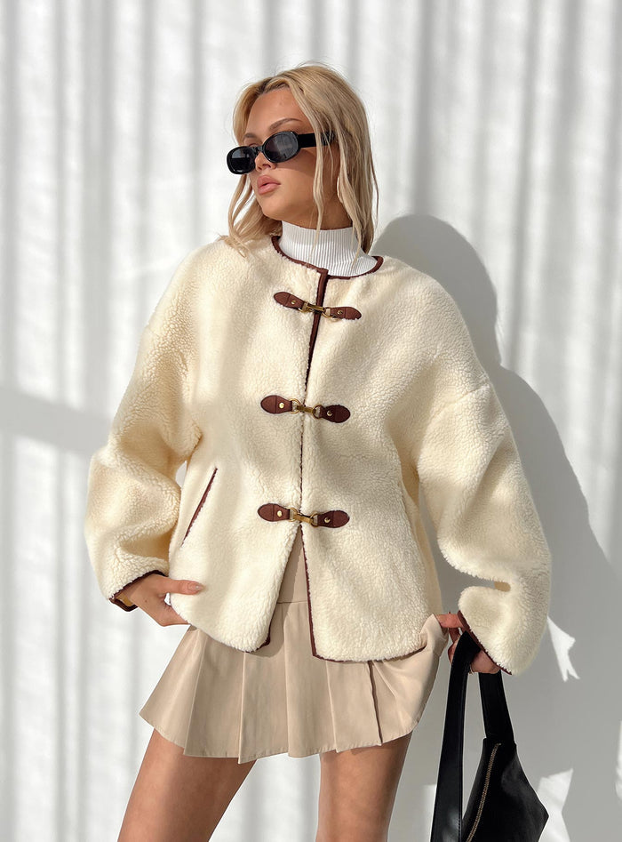 Teddy coat Relaxed fit, twin hip pockets, drop shoulder  Gold-toned clasp fastening down front