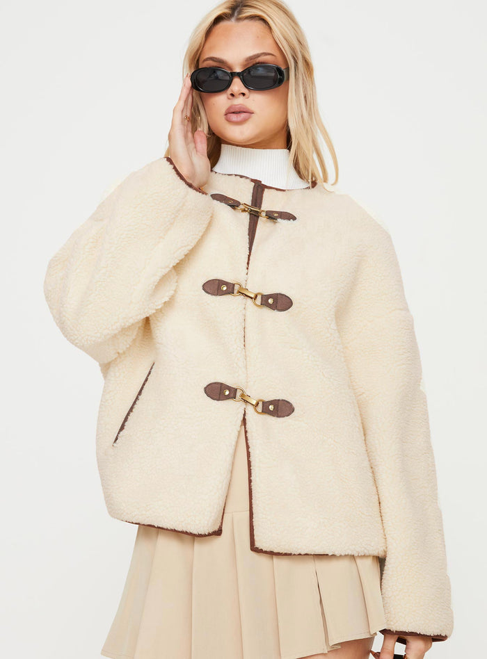 Teddy coat Relaxed fit, twin hip pockets, drop shoulder  Gold-toned clasp fastening down front