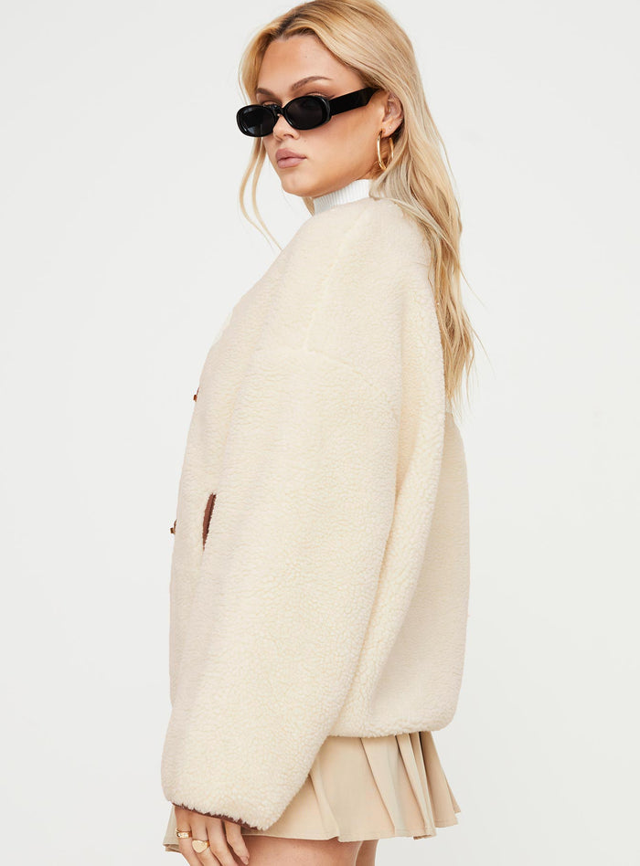 Teddy coat Relaxed fit, twin hip pockets, drop shoulder  Gold-toned clasp fastening down front