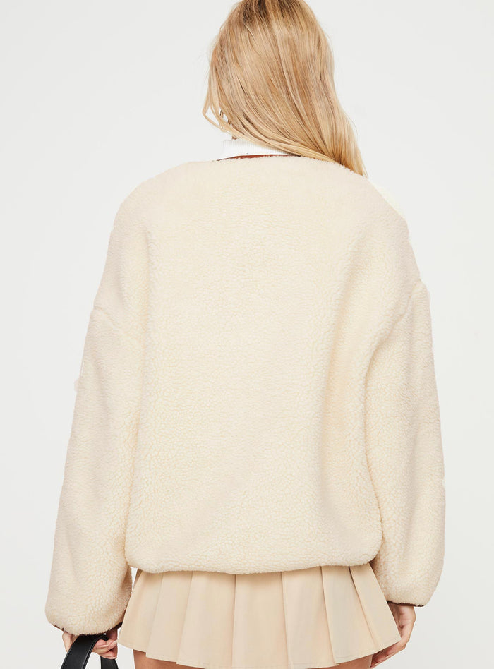Teddy coat Relaxed fit, twin hip pockets, drop shoulder  Gold-toned clasp fastening down front