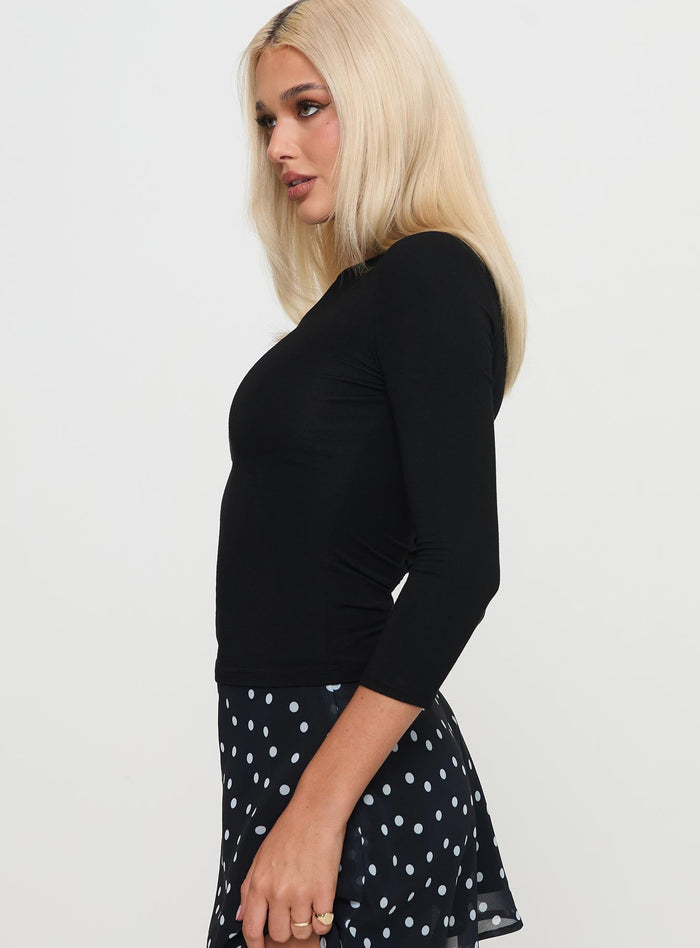 side view of model wearing Princess Polly Alouette Long Sleeve Top Black Three Fourth Sleeves Boat Neck