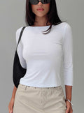 side view of model wearing Princess Polly Alouette Long Sleeve Top White Three Fourth Sleeves Boat Neck