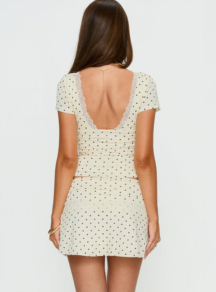 back view of model wearing Princess Polly Amia Lace Mini Skirt Cream Polka Dot Mini Skirts Skirts
