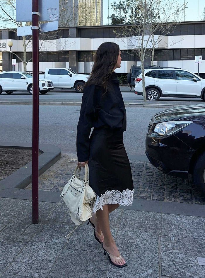 back view of model wearing Princess Polly Anchored Midi Skirt Noir Midi Skirts