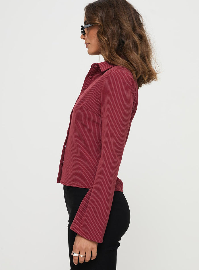 side view of model wearing Princess Polly Anni Pinstripe Shirt Red Full Sleeves V-Neck