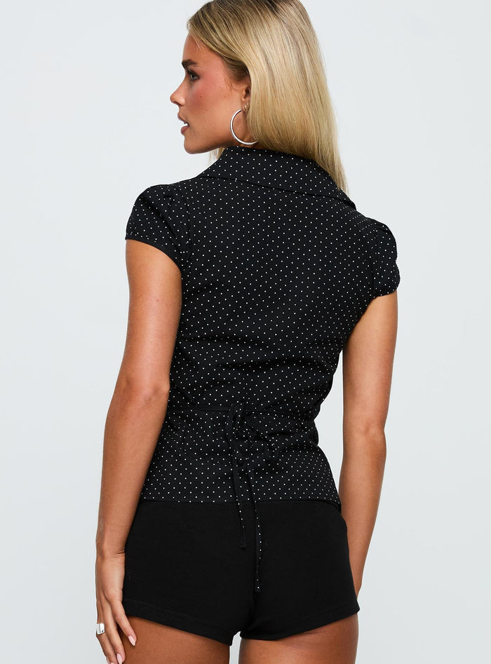 back view of model wearing Princess Polly Arianwyn Short Sleeve Shirt Black Polka Short Sleeves V-Neck