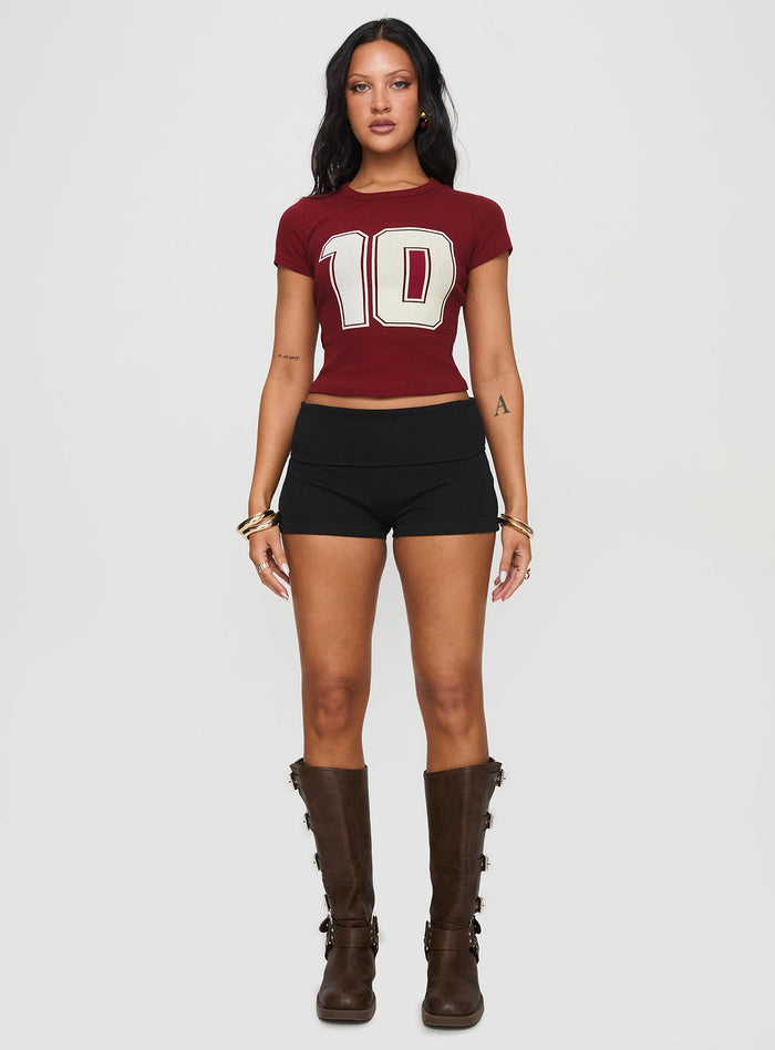 side view of model wearing Princess Polly Baseline Low Rise Rib Shorts Black High Waisted Shorts