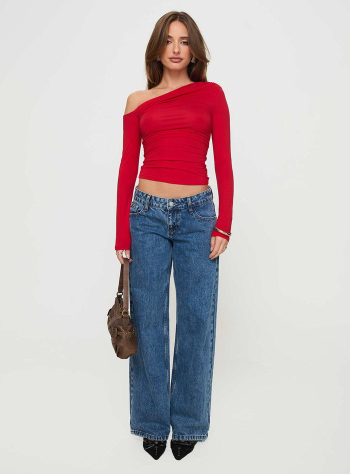 side view of model wearing Princess Polly Beller Long Sleeve Top Red Full Sleeves Asymmetric Neckline