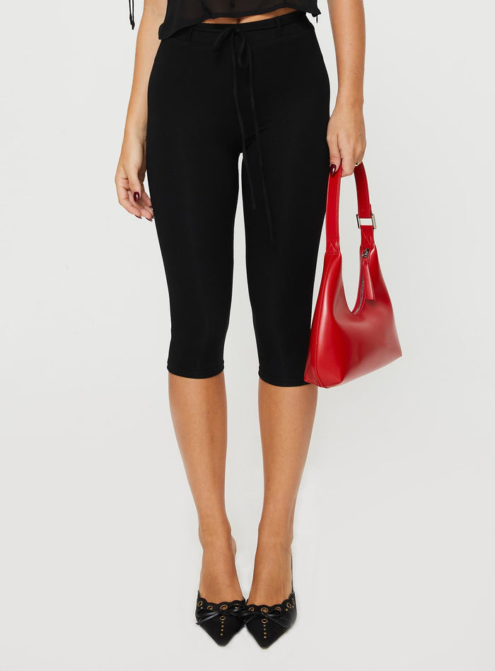 front view of model wearing Princess Polly Cayte Capris Black High Waisted Pants