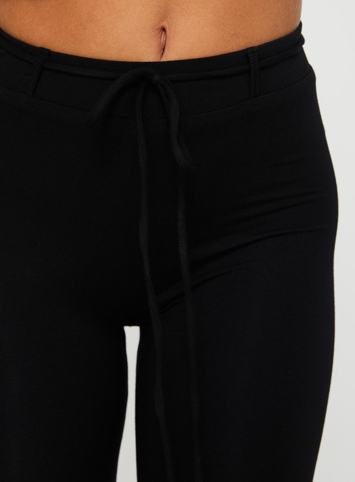 back view of model wearing Princess Polly Cayte Capris Black High Waisted Pants