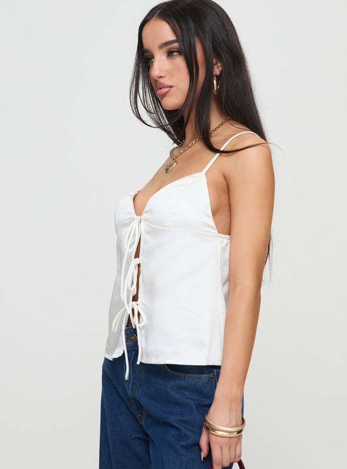 side view of model wearing Princess Polly City Scene Top White Sleeveless Plunger