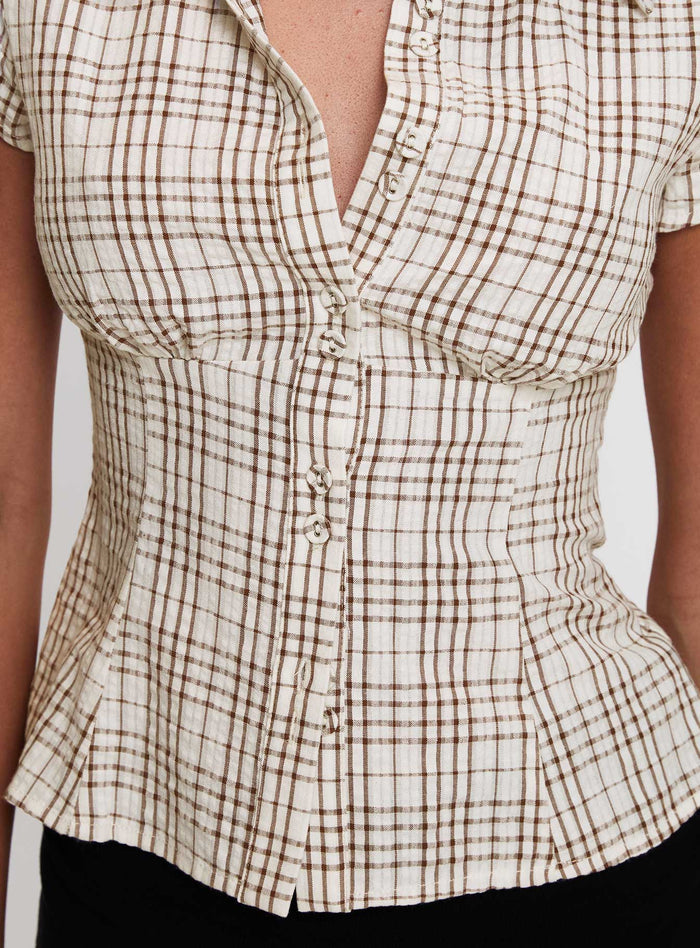 back view of model wearing Princess Polly Cottesloe Blouse Top Brown Check Short Sleeves V-Neck