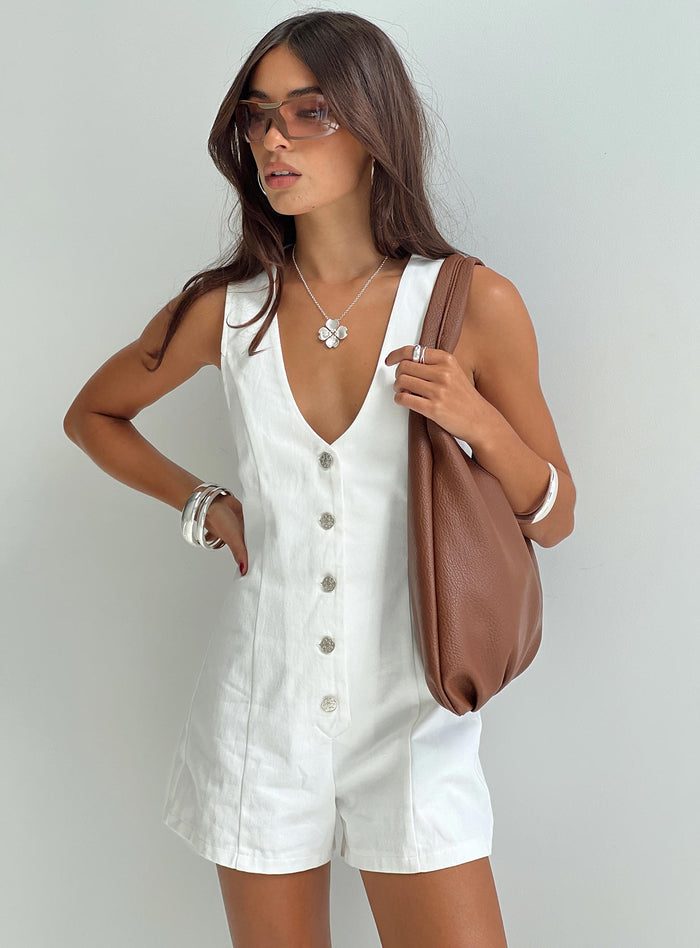 Romper Fixed shoulder straps, scooped neckline, button fastening down front Non-stretch material, unlined