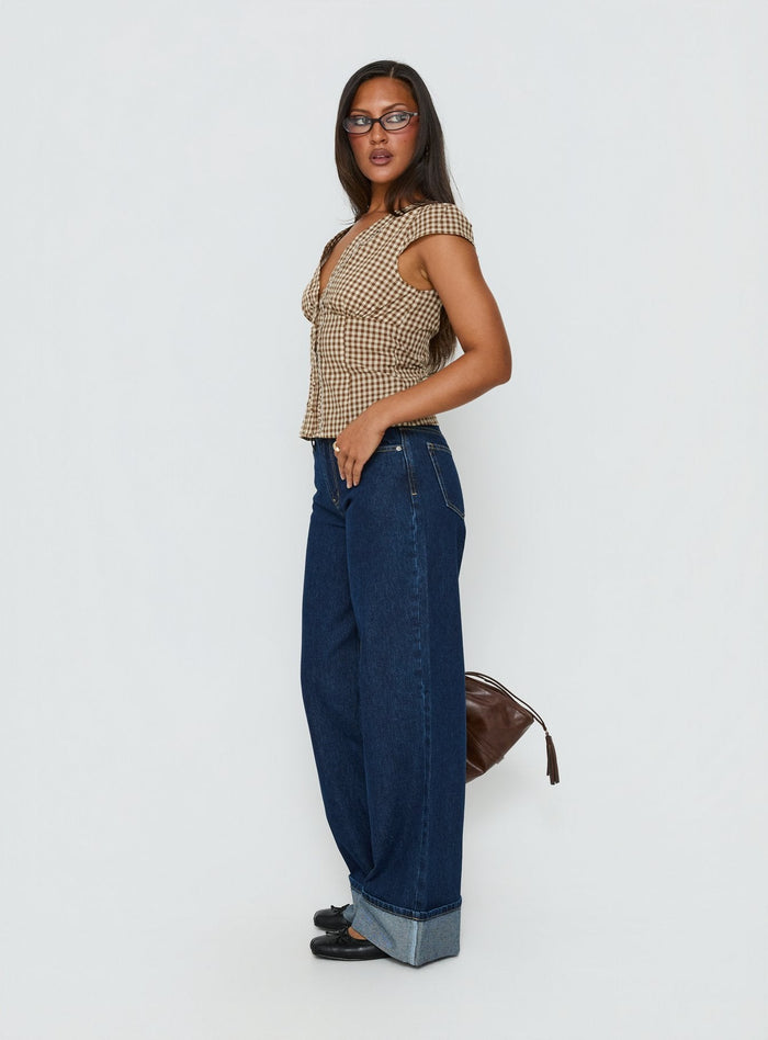 side view of model wearing Princess Polly Darla Low Rise Straight Leg Cuff Jean Dark Blue Wash Low Rise Jeans Jeans