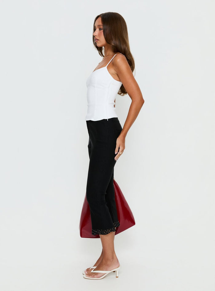 side view of model wearing Princess Polly Darsie Frill Capri Black Polka Dot High Rise Pants