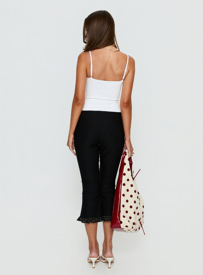 back view of model wearing Princess Polly Darsie Frill Capri Black Polka Dot High Rise Pants