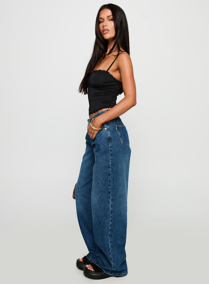 side view of model wearing Princess Polly Duster Oversized Jeans Dark Wash Mid Rise