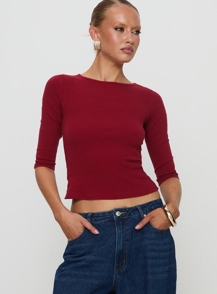 front view of model wearing Princess Polly Elaia 3/4 Sleeve Top Red Three Fourth Sleeves Crew Neck