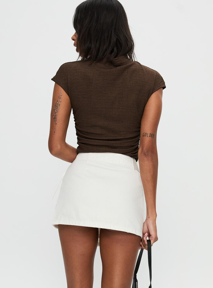back view of model wearing Princess Polly Elinora Wrap Mini Skirt White Mini Skirts