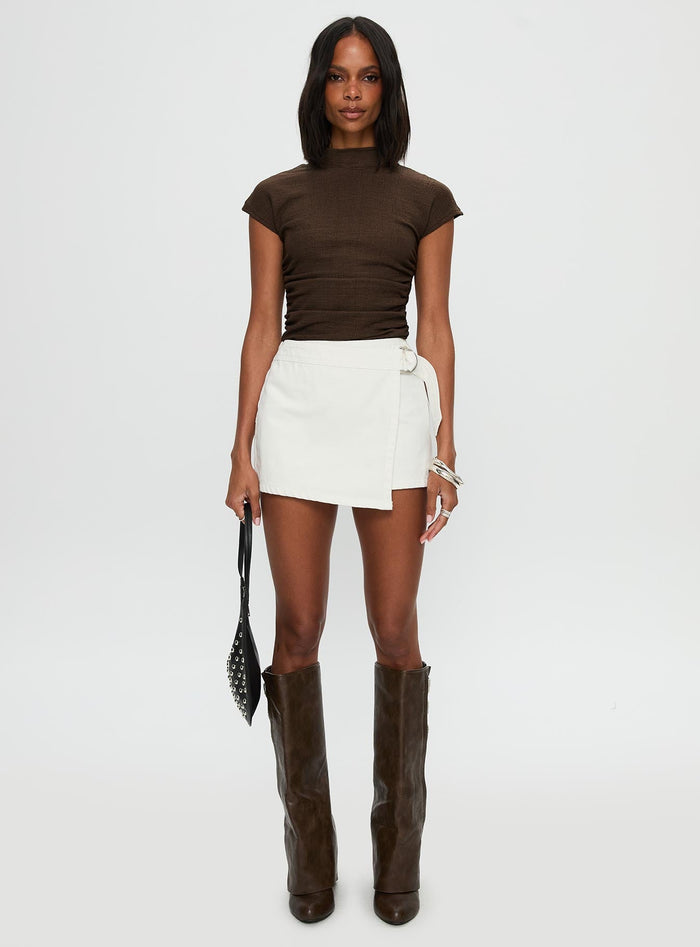 front view of model wearing Princess Polly Elinora Wrap Mini Skirt White Mini Skirts