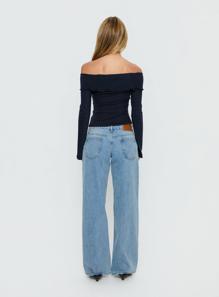 back view of model wearing Princess Polly Ellanor Low Rise Slouch Denim Jean Washed Mid Blue Wash Low Rise Jeans