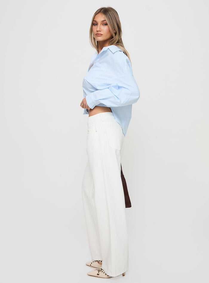 side view of model wearing Princess Polly Ellanor Low Rise Straight Leg Jeans White Mid Rise Jeans