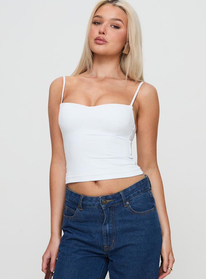 side view of model wearing Princess Polly Evanda Top White Sleeveless Sweetheart
