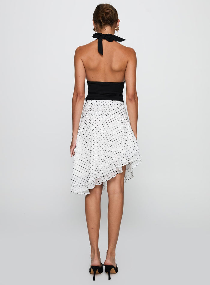 back view of model wearing Princess Polly Evanescence Asymmetrical Midi Skirt White / Polka Dot Midi Skirts