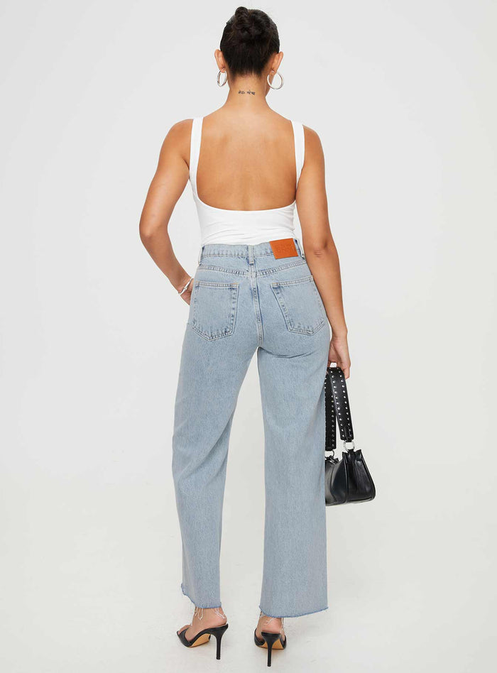 back view of model wearing Princess Polly Fawcett Jeans Light Wash Denim High Waisted