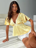 front view of model wearing Princess Polly For The Summer Lace Trim Top Yellow Short Sleeves Plunger