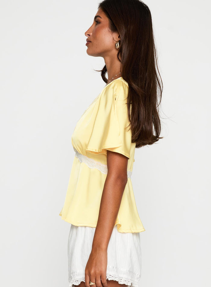side view of model wearing Princess Polly For The Summer Lace Trim Top Yellow Short Sleeves Plunger