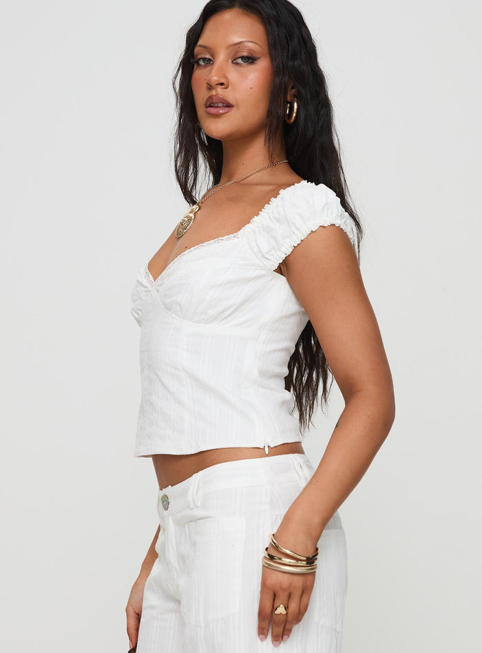 side view of model wearing Princess Polly Fyrie Top White Short Sleeves V-Neck