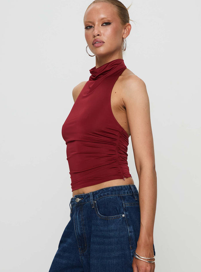 side view of model wearing Princess Polly Giggle Top Burgundy Sleeveless Cowl