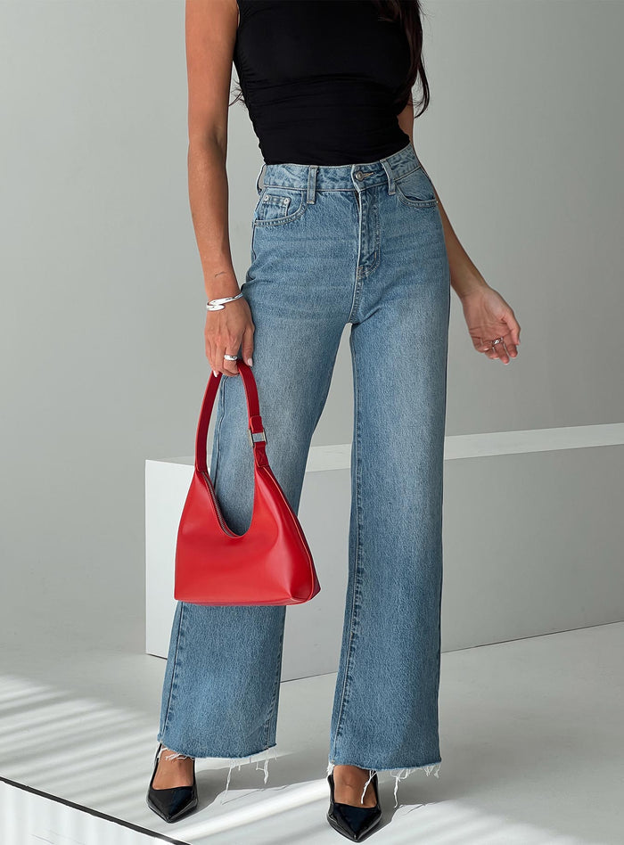 back view of model wearing Princess Polly Henesey Raw Hem Jeans Mid Wash High Waisted