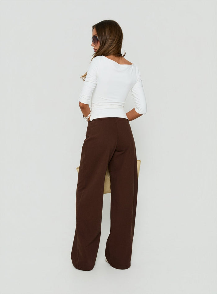 Displaying the Hereos Mid Rise Baggy Leg Jeans Washed Chocolate in womens-jeans back view of model wearing Princess Polly