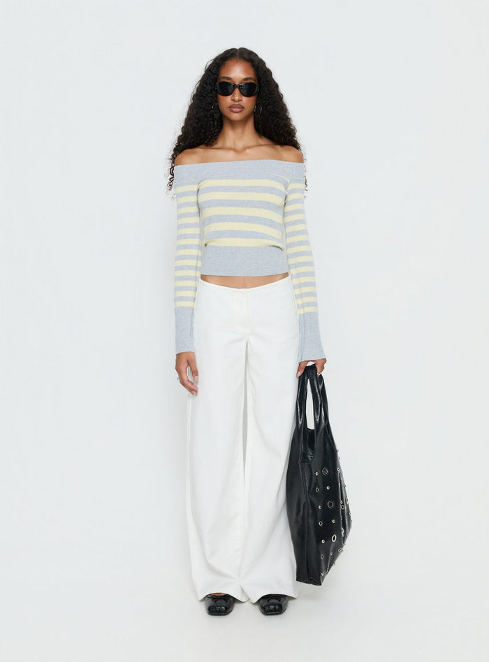 side view of model wearing Princess Polly Hereos Mid Rise Baggy Leg Jeans White Mid Rise Jeans Jeans