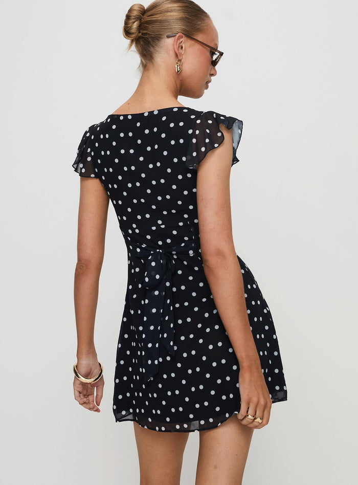 back view of model wearing Princess Polly I Guess So Mini Dress Black Polka Dot V-Neck