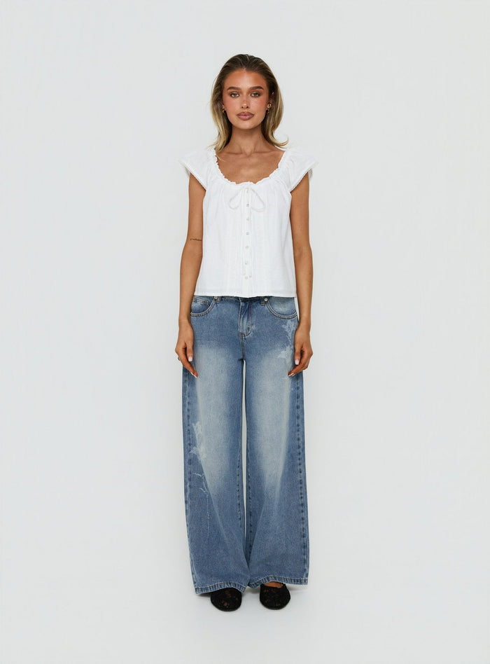 Featuring Johnni Floral Printed Low Rise Jeans Mid Wash womens-jeans with low-rise waist detail Princess Polly