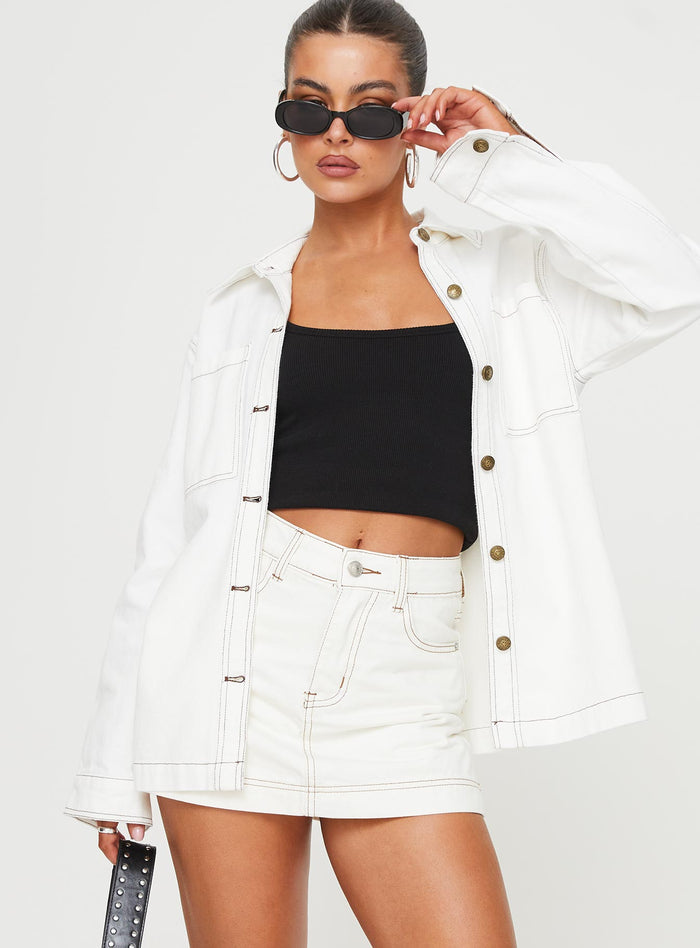 front view of model wearing Princess Polly Katlynne Denim Mini Skort White mid-rise