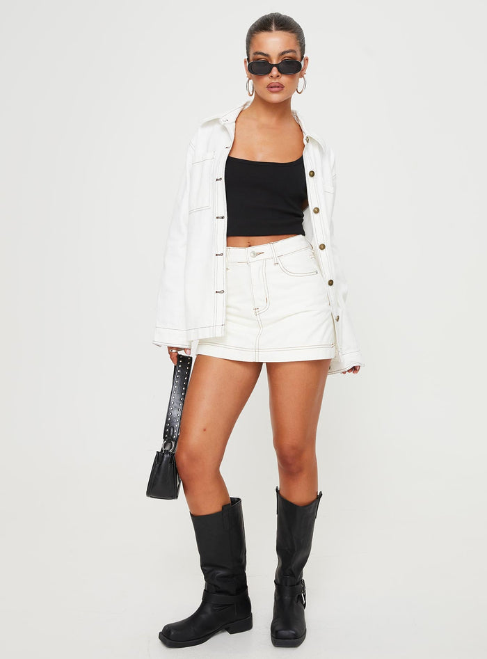 front view of model wearing Princess Polly Katlynne Denim Mini Skort White mid-rise