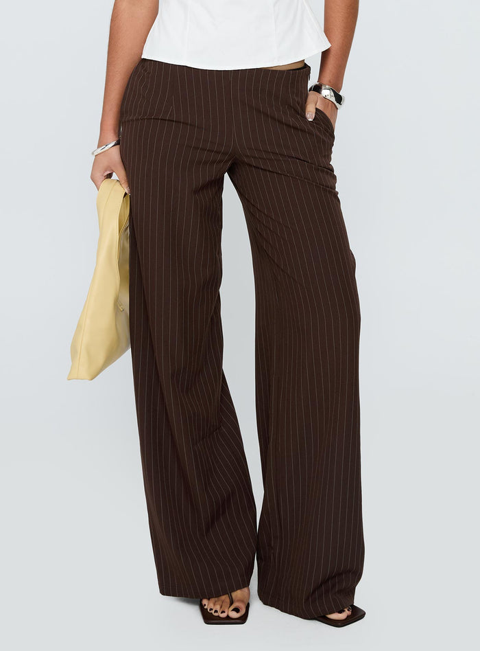 side view of model wearing Princess Polly Khane Low Rise Wide Leg Pant Brown Pinstripe Low Rise Pants