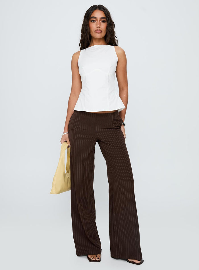 front view of model wearing Princess Polly Khane Low Rise Wide Leg Pant Brown Pinstripe Low Rise Pants