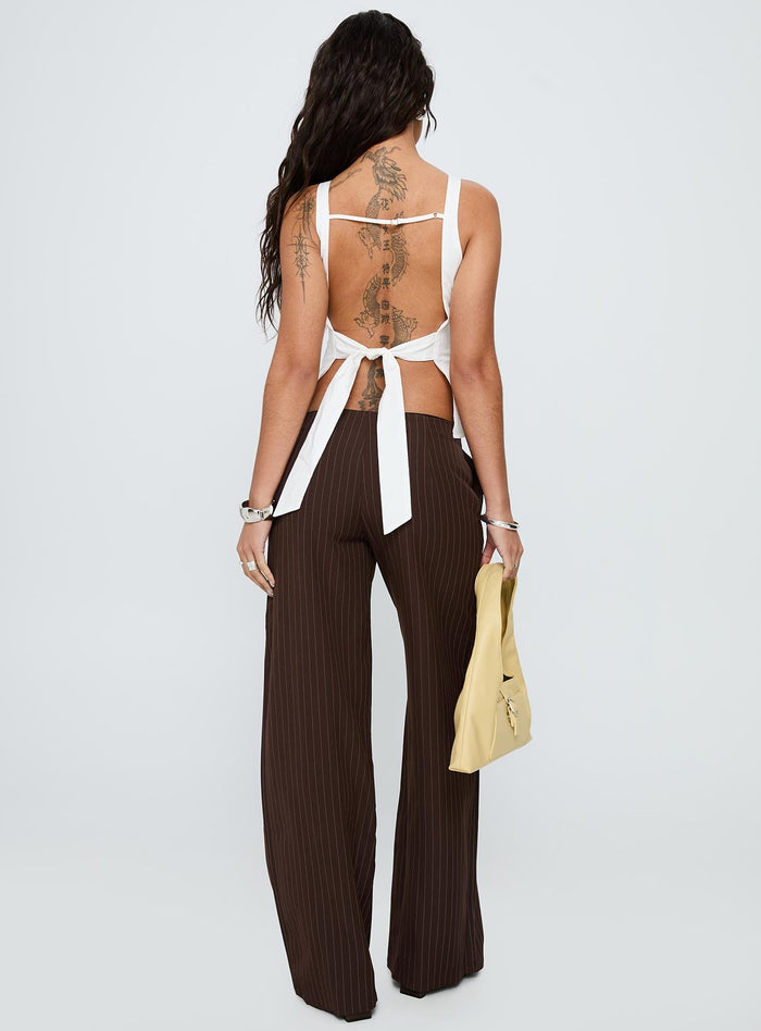 back view of model wearing Princess Polly Khane Low Rise Wide Leg Pant Brown Pinstripe Low Rise Pants