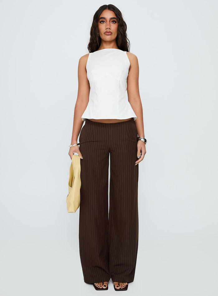 front view of model wearing Princess Polly Khane Low Rise Wide Leg Pant Brown Pinstripe Low Rise Pants