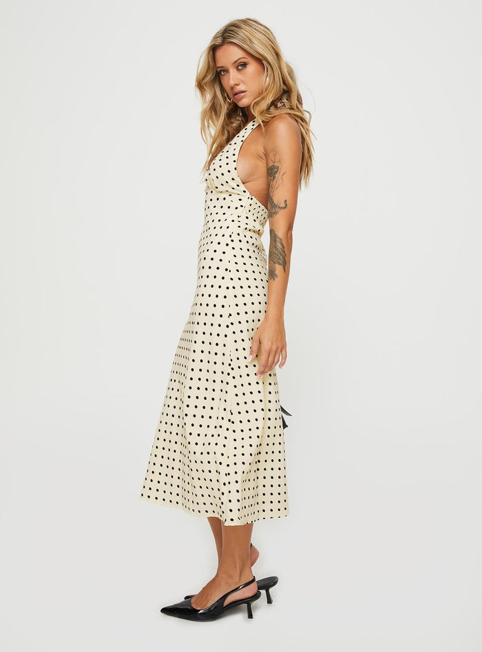 side view of model wearing Princess Polly Kimbelle Halter Maxi Dress Cream / Polka Dot Plunger