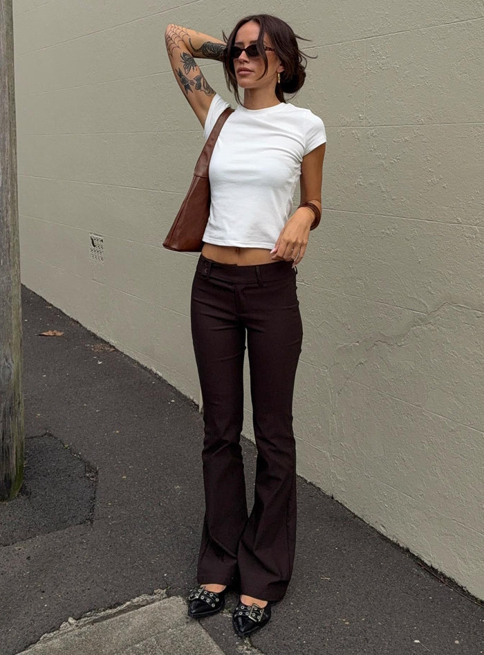 front view of model wearing Princess Polly Kinkirk Flared Pants Chocolate Tall Low Rise Pants