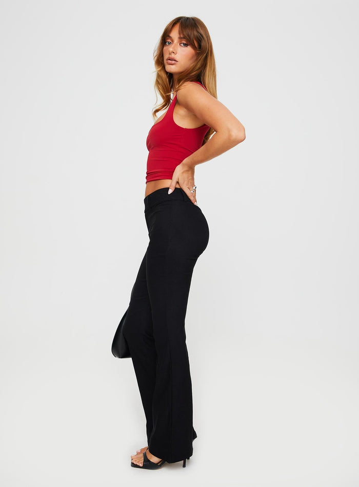 side view of model wearing Princess Polly Kinkirk Flared Pants Black Tall High Waisted Pants