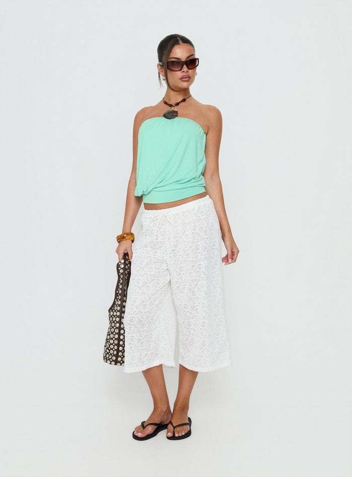 Introducing the Kiss Me Quick 3/4 Lace Drawstring Pants in White with mid-rise womens-regular-pants front view of model wearing Princess Polly