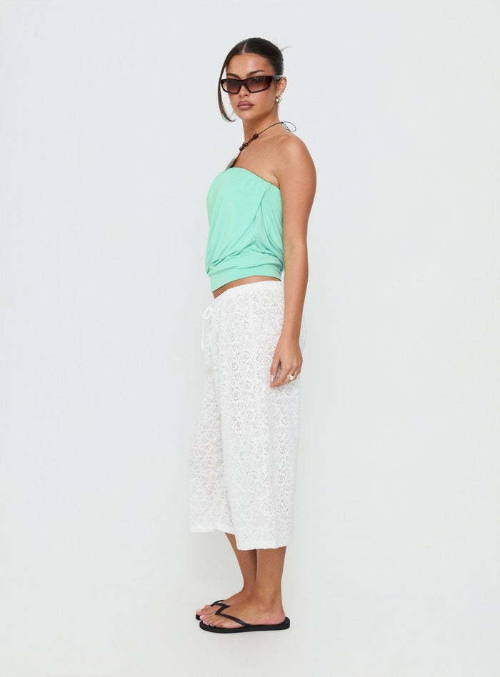 Discover the Kiss Me Quick 3/4 Lace Drawstring Pants in White featuring mid-rise womens-regular-pants side view of model wearing Princess Polly