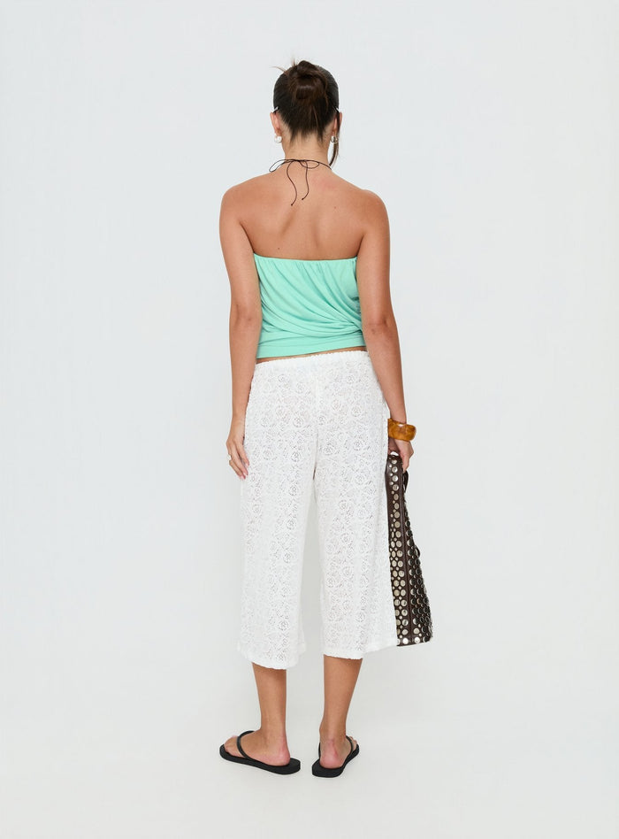 See the Kiss Me Quick 3/4 Lace Drawstring Pants in White featuring mid-rise womens-regular-pants back view of model wearing Princess Polly